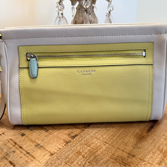 Coach Handbags - Coach Two-Tone Yellow and White Clutch. New without Tags.